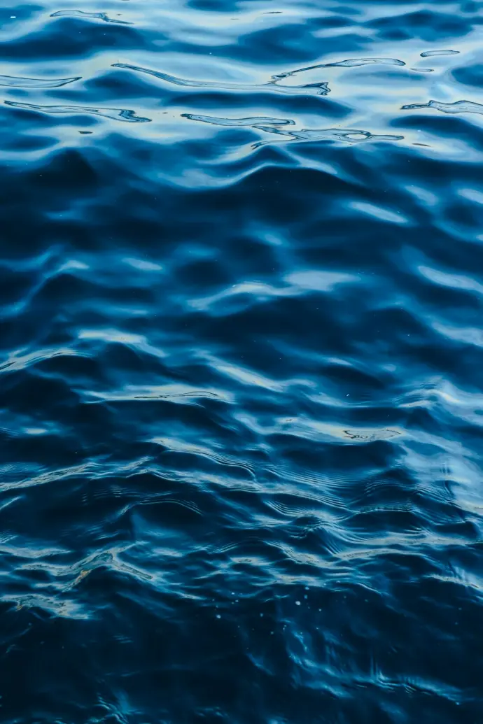 a boat floating on top of a body of water